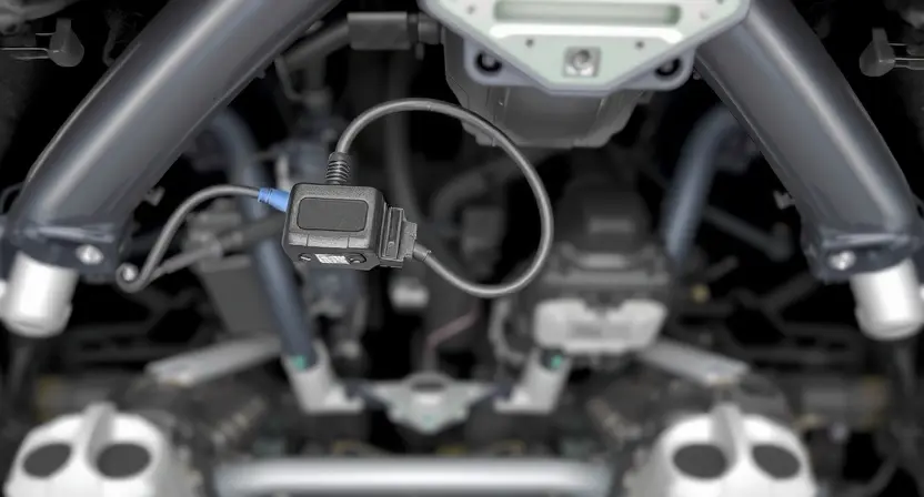 A close-up, detailed illustration of a car's undercarriage, specifically focusing on the area where an accelerometer sensor is located. The sensor should be clearly visible, connected by wires to the car's wiring harness. The background should show other components of the car's chassis, but blurred to keep the focus on the sensor. The overall lighting should be bright and even, highlighting the details of the sensor and wiring.